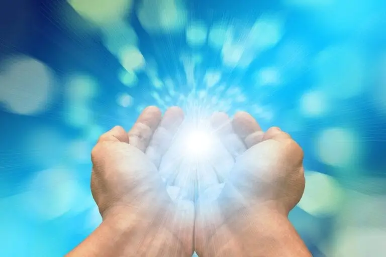 Hans holding mystical light